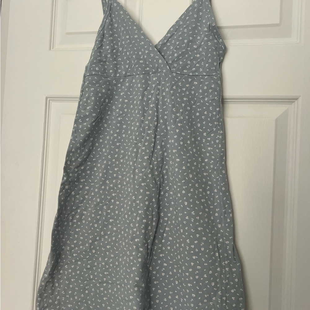 Blue Sleeveless Dress with White Floral Pattern